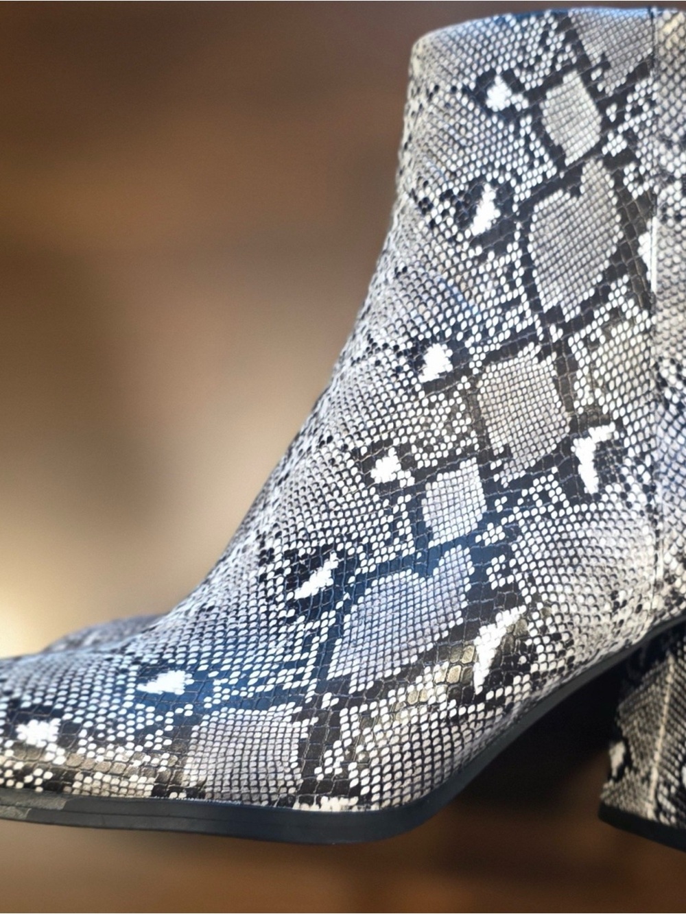 Madden Girl Snake Print Ankle Heeled Boots in Black and White